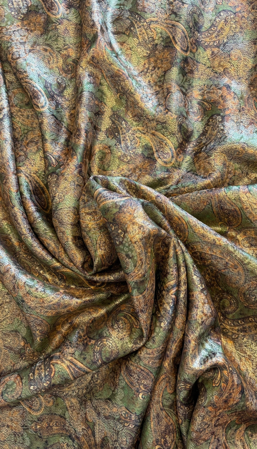 A piece of green gold-embroidered silk